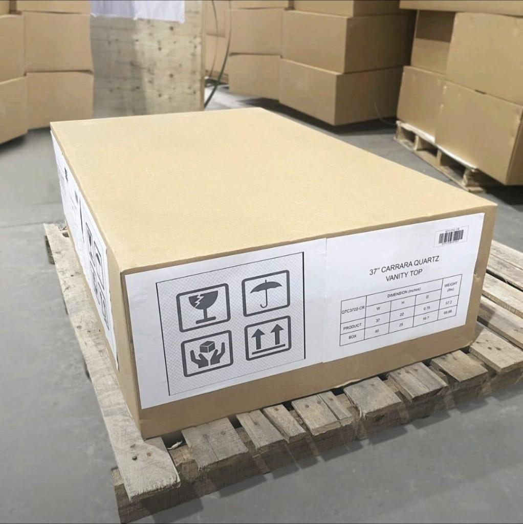 Labeled vanity-top carton on a pallet with fragile and orientation shipping marks
